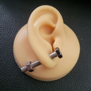Silver nut and bolt shaped illusion post earrings